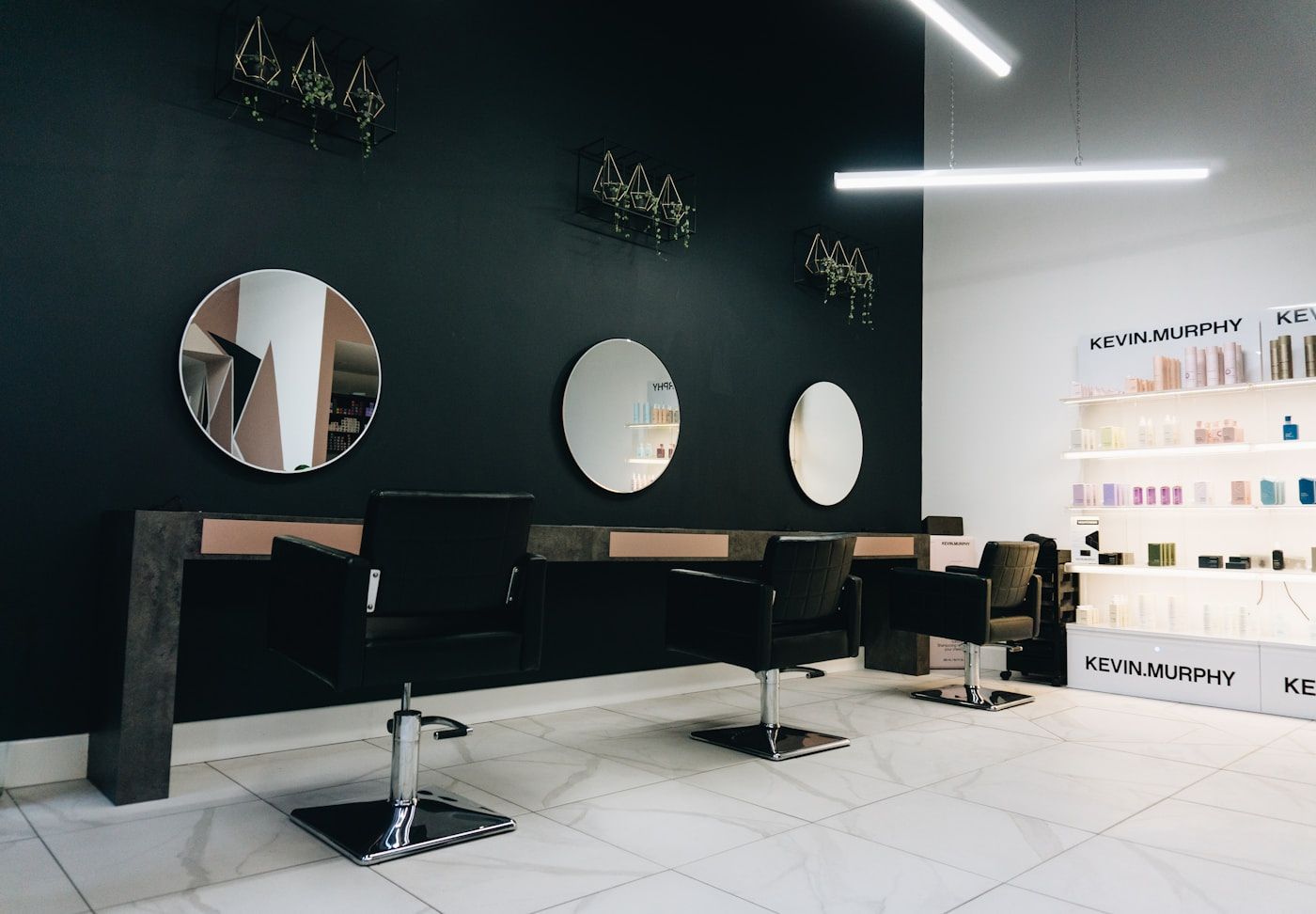 Salon owner reviewing notes at a styling station
